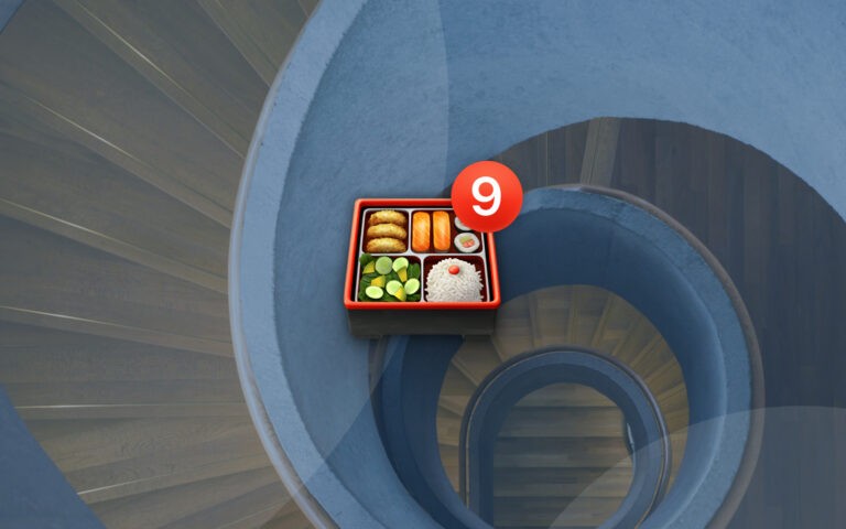 Bento box emoji with number 9 badge on spiral stair background